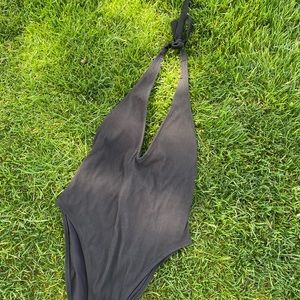 Size S Aerie one piece swim suit. Solid black with halter tie and cheeky. NWT!